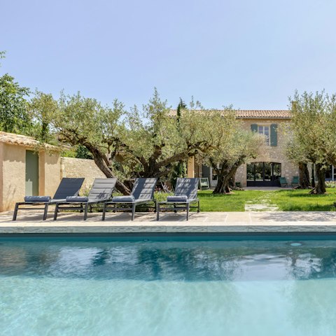 Spend lazy afternoons lounging by the private pool