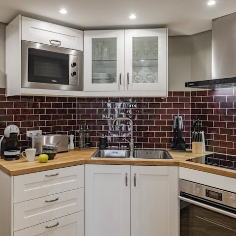 Rustle up a spot of dinner in your sleek kitchen