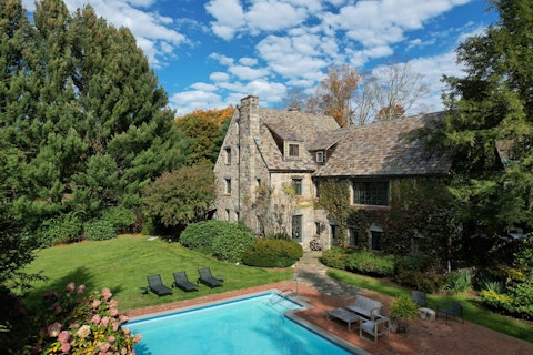 Cool off in the saltwater pool beside the ivy-clad estate
