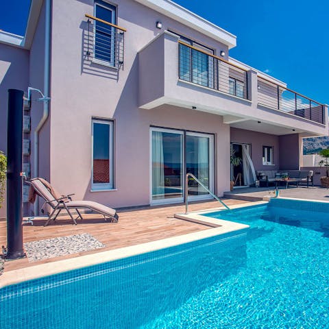 Go for a dip in the private pool under the sun, and dry off naturally on the poolside loungers