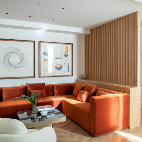 Sink into the velvet modular sofa in the stylish living room