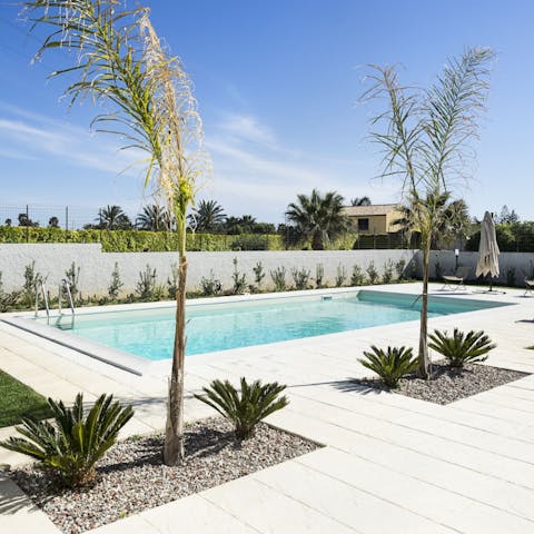 Spend relaxing days by the swimming pool or wander down to the beach