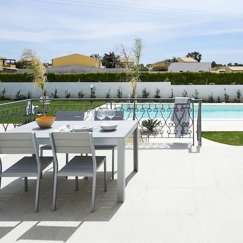 Pour a glass of local wine and share the magic of Italian living from the terrace