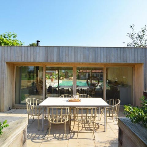 Gather together for outdoor meals on the patio