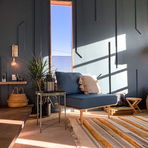 Kick back with a cool drink as you admire your desert surroundings from the tall windows