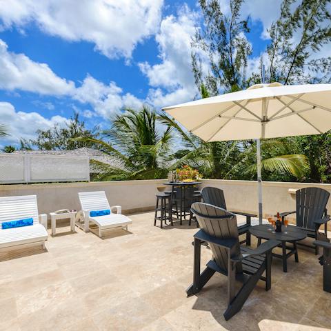 Head up to the rooftop terrace to soak up the sun on a lounger, or enjoy your coffee in the seating area