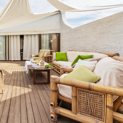 Relax with a cup of coffee and a magazine on the patio