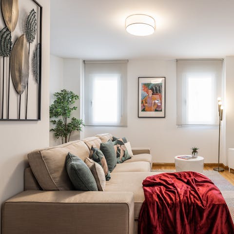 Kick back in the stylish living room with a glass of Spanish wine after a day of exploring the city