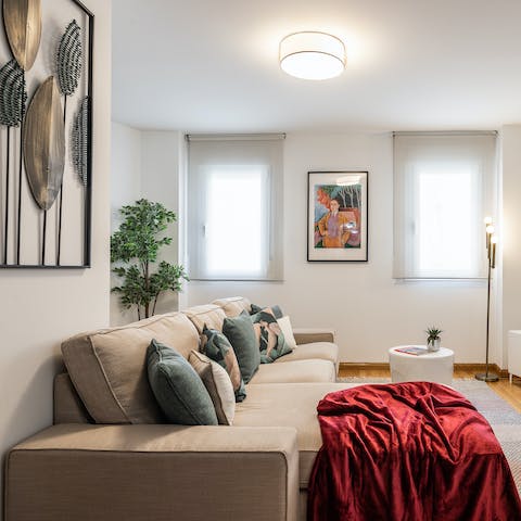 Kick back in the stylish living room with a glass of Spanish wine after a day of exploring the city
