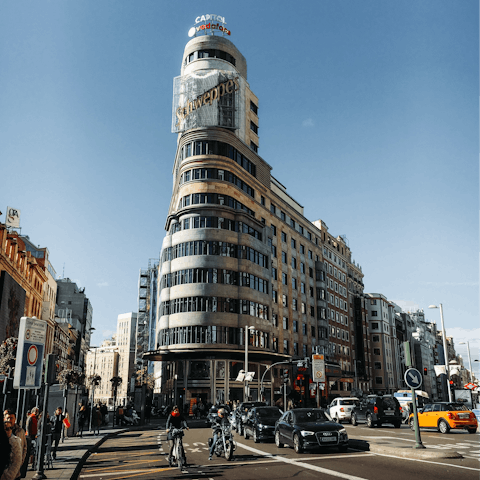 Admire Gran Vía's striking architecture and many shops, a twenty-two-minute walk away
