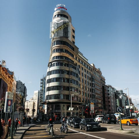 Admire Gran Vía's striking architecture and many shops, a twenty-two-minute walk away