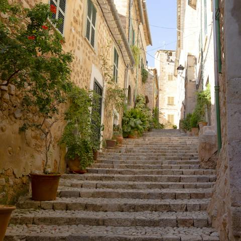 Explore the traditional mountain village of Fornalutx, just a fifteen-minute drive from Port de Sóller