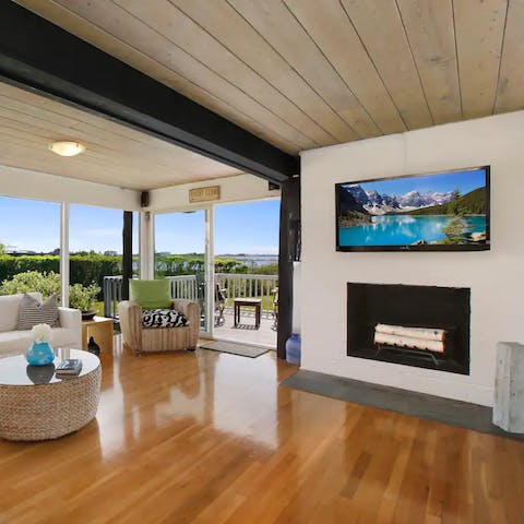 Get cosy in front of the fire in the bright lounge