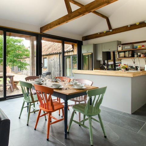 Enjoy a full English breakfast at your dining table with its colourful chairs