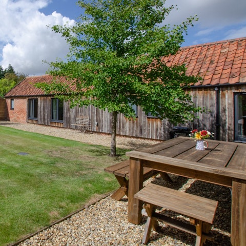 Have a glass of wine in the pretty, enclosed garden