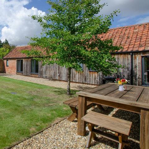 Have a glass of wine in the pretty, enclosed garden