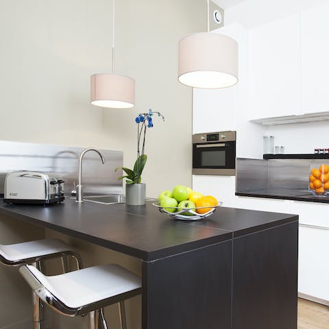 Start mornings with fresh coffee and croissants at the sleek breakfast bar