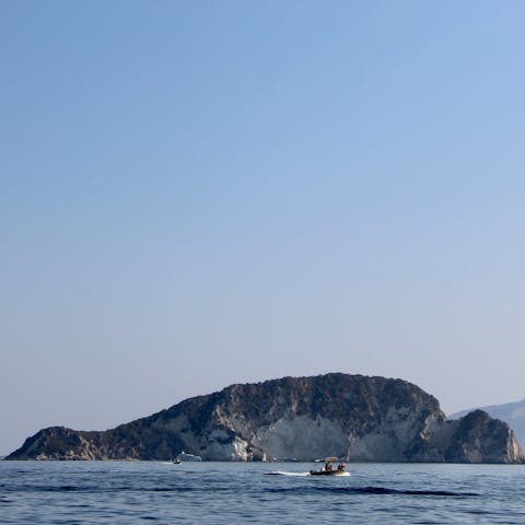 Hire a boat and head across the water to explore he small island of Marathonisi