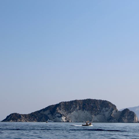 Hire a boat and head across the water to explore he small island of Marathonisi