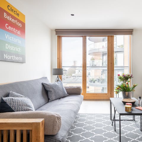 Kick back in the bright living room with a glass of wine after a day of exploring the city on foot