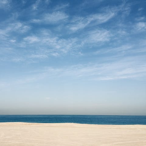 Enjoy the sun at Jumeirah beach, fifteen minutes away