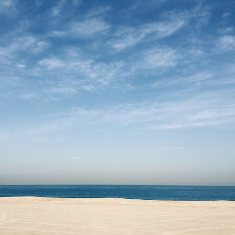 Enjoy the sun at Jumeirah beach, fifteen minutes away