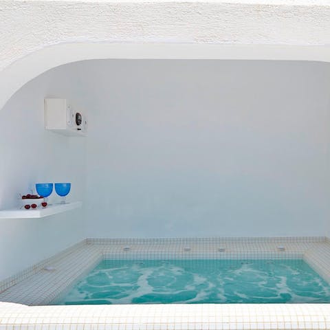 Pop open a bottle of fizz and watch the sunset from your private hot tub