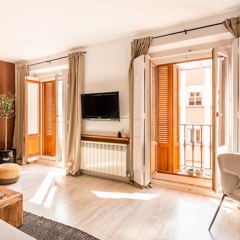 Open up the pretty French doors and make the most of your traditional wrought-iron balcony
