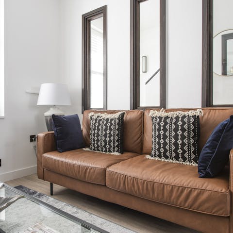 Cosy up after a long day on the leather sofa