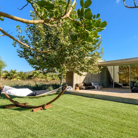 Drift off under the shade of the mimosa trees