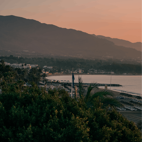 Enjoy a beach day, then dine along the Puerto Banus waterfront
