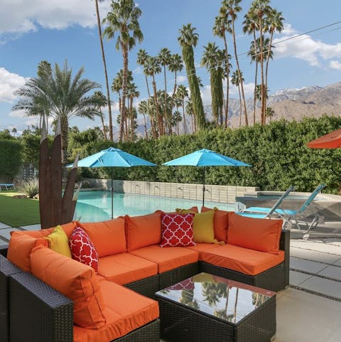 Relax in style on the colourful rattan sofa