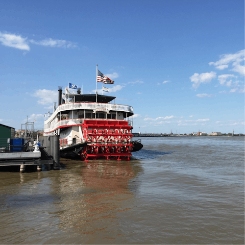 Sail along the Mississippi River on Steamboat Natchez, a fifteen-minute walk away