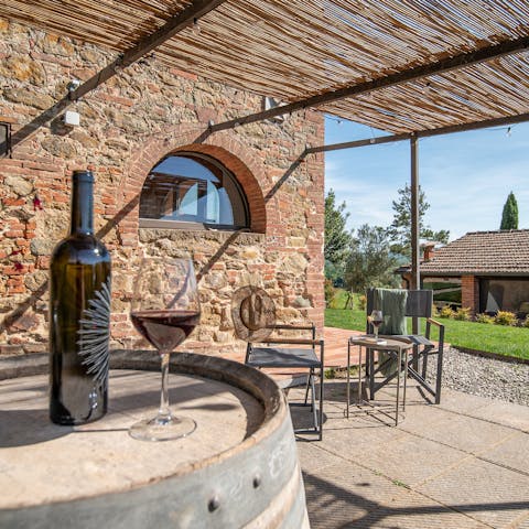 Savour delicious local wine while relaxing on the terrace