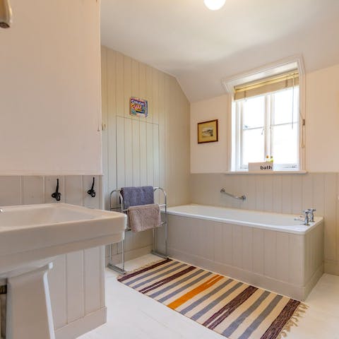 Treat yourself to a bubble bath and ease into the relaxation with a good book