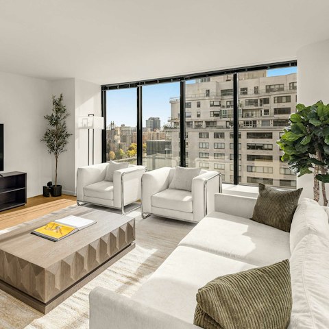Enjoy the city views while sipping drinks in the living room