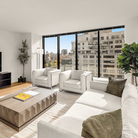Enjoy the city views while sipping drinks in the living room