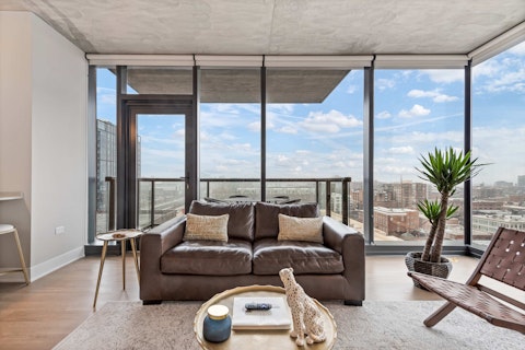 Cook, dine, and unwind with the city skyline stretching before you