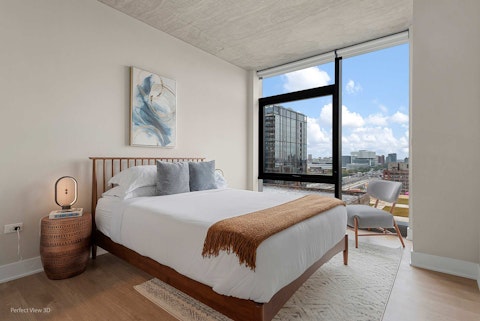Wake to panoramic Chicago skyline views from the main bedroom