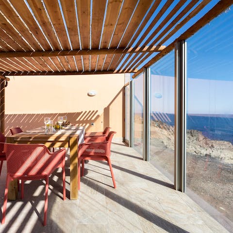 Enjoy authentic tapas in the shaded terrace, while the sun goes down