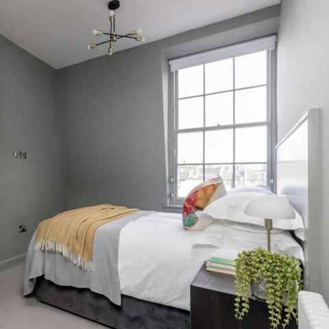 Wake to rooftop views over the city
