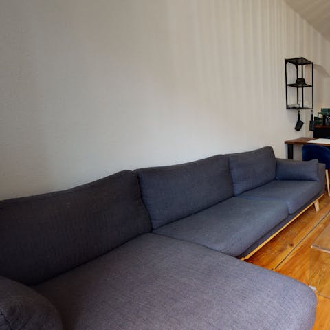 Stretch out in the living area after a day of discovering the city's cobbled streets