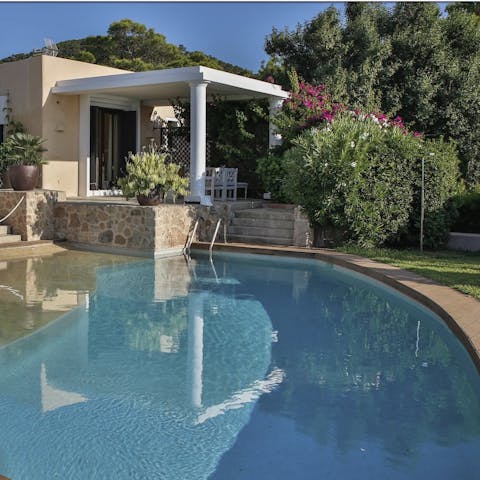 Lounge by the pool with sweeping sea views