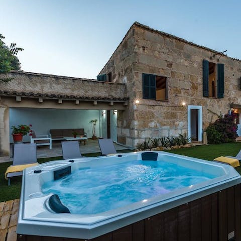 Relax in the Jacuzzi with a glass of fizz