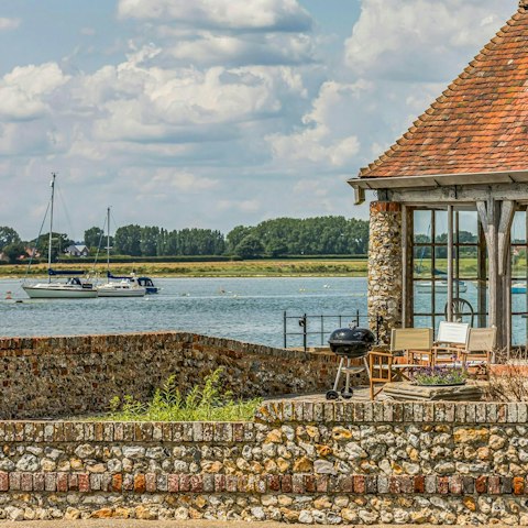 Fire up the barbecue and watch the boats glide by from the garden