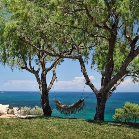 Get stuck into a good book as you recline in the hammock