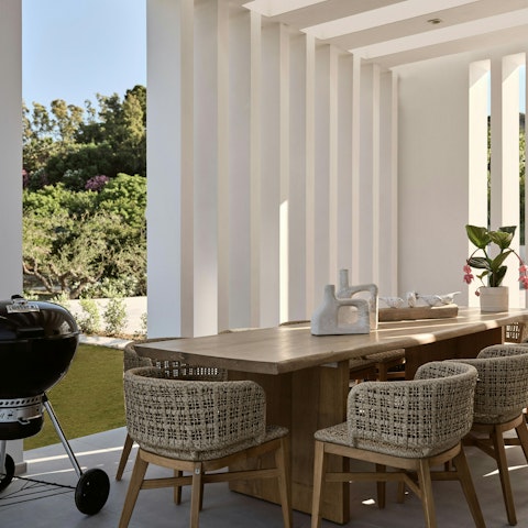 Sip a glass of Greek wine as the barbecue starts to sizzle