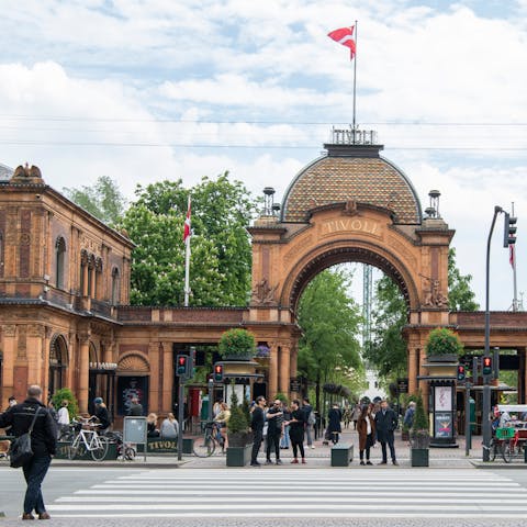 Cross the pedestrian bridge to lively Tivoli