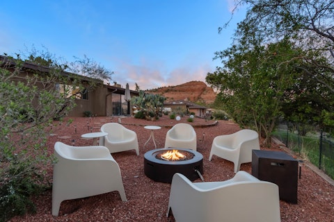 Gather around the fire pit beneath Sedona's dusk-lit sky