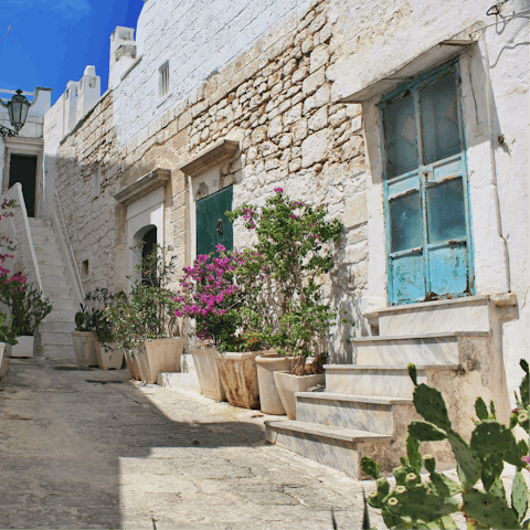 Explore the white-washed houses of Ostuni, a ten-minute drive away